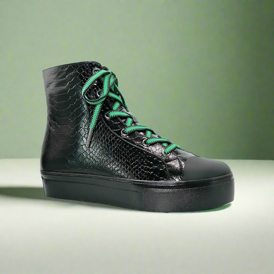 Black high-top sneaker with green lace-up, side zipper and thick platform sole