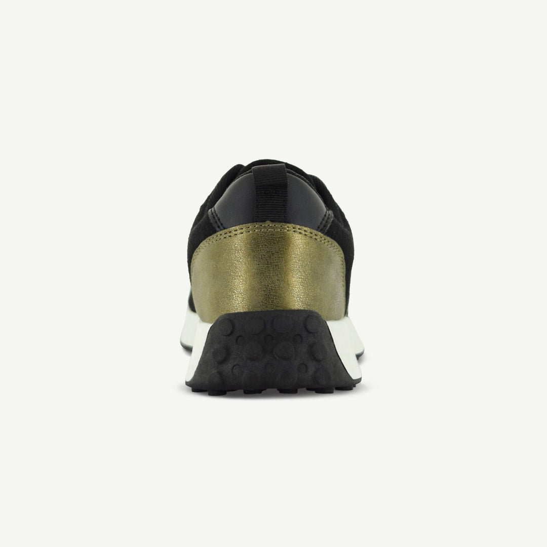 Retro Runner back view with black upper, gold heel cap, and textured rubber outsole