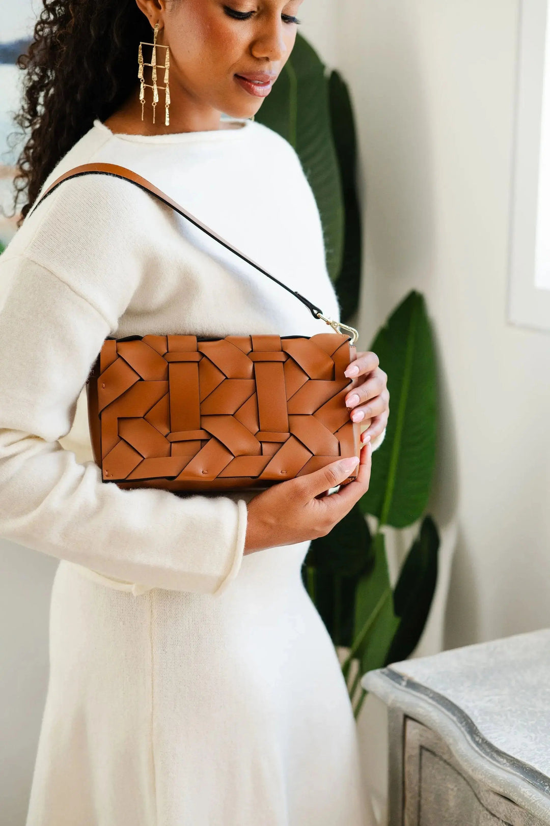 Camel THE ZENOBIA woven clutch close-up with interlaced geometric leather panels