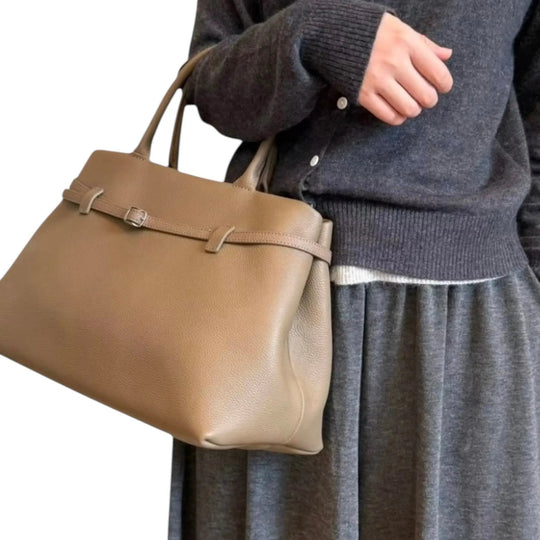 THE XL Sarah Large belt tote bag in taupe, structured leather look, top handles and buckle strap.