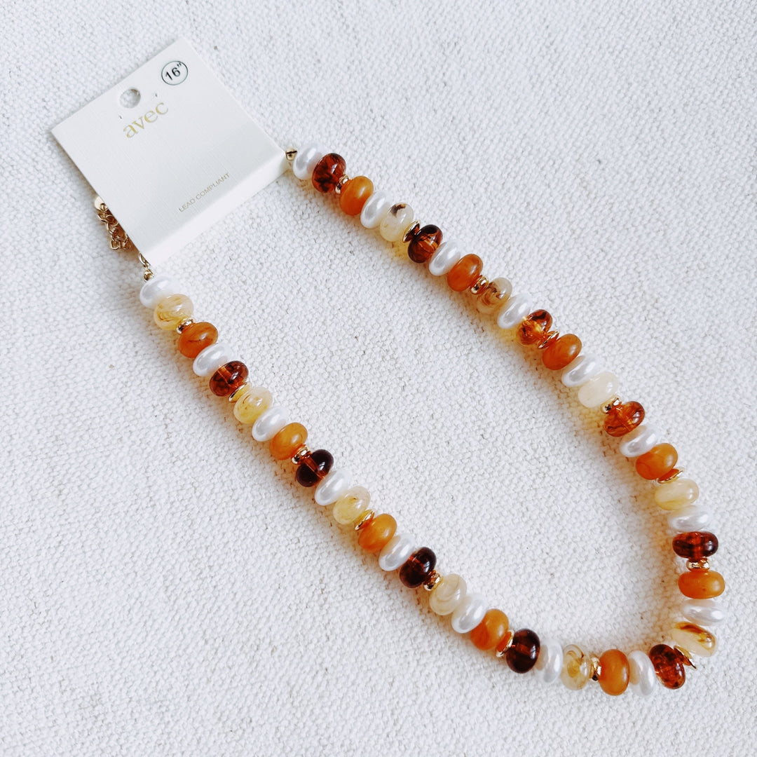 Ellisonyoung.com beaded necklace; warm orange, amber, and white round beads with clasp