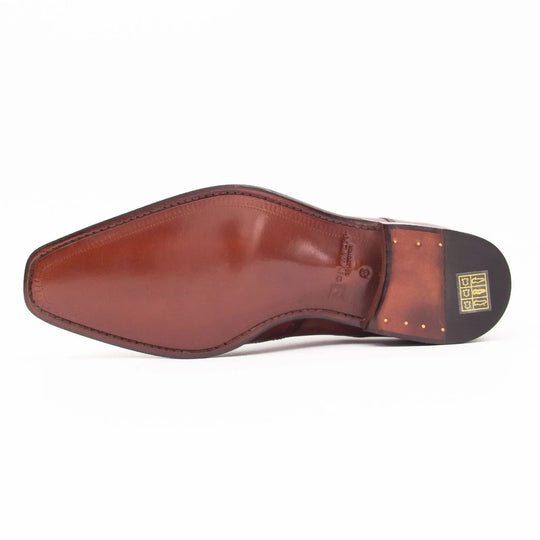 Brown brogue derby shoe outsole view with heel tread and logo patch