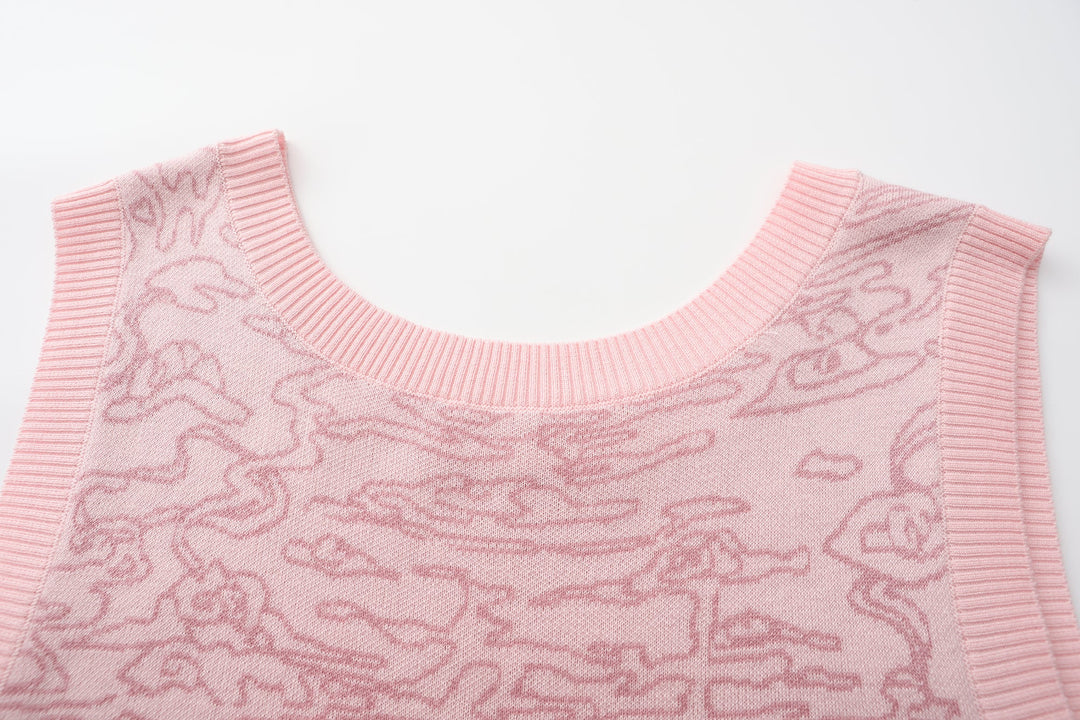 Light pink knit sweater vest neckline and shoulders, ribbed trim, tonal jacquard motif