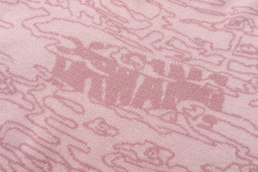 Light pink jacquard knit fabric texture with raised pattern detail