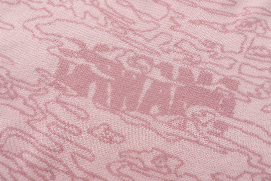 Light pink jacquard knit fabric texture with raised pattern detail
