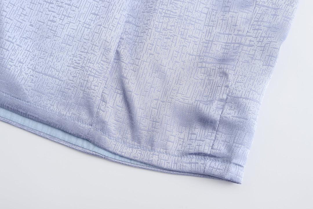 Periwinkle mini dress hem and subtle textured brocade pattern