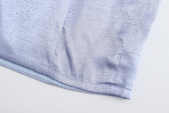 Periwinkle mini dress hem and subtle textured brocade pattern