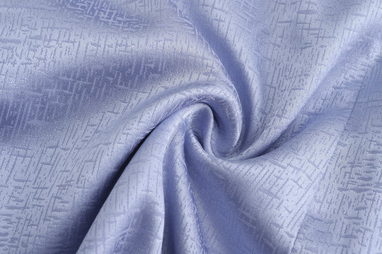 Periwinkle brocade fabric with woven geometric texture