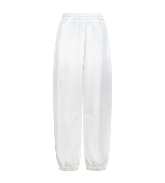 Off-white lounge pants, flat lay back view with elastic waistband and tapered legs