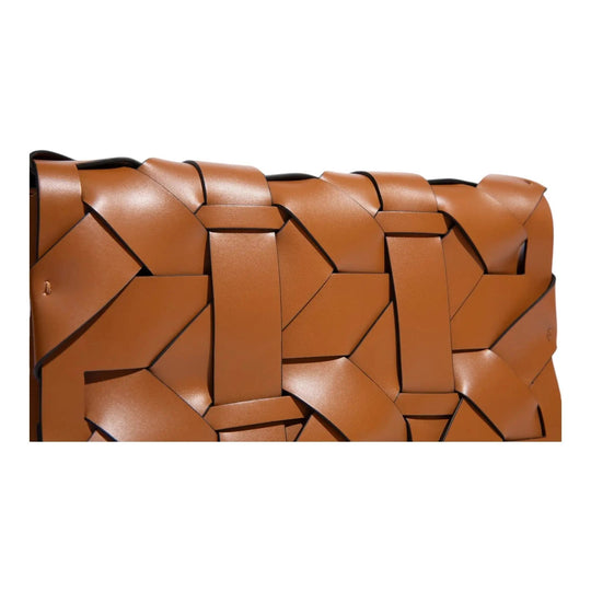 Camel-brown woven clutch close-up with interlocking geometric blocks