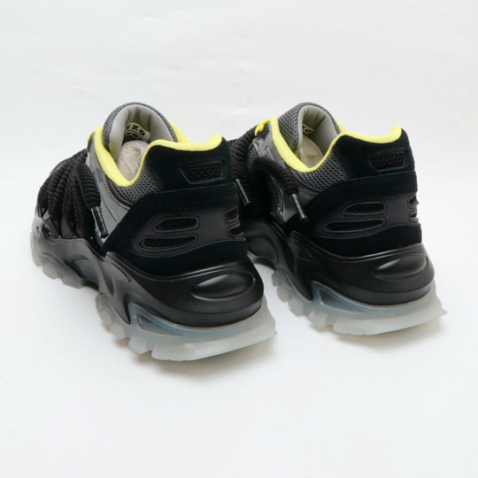 ICON V2 “Shadow” heel view, black uppers with neon yellow collar lining