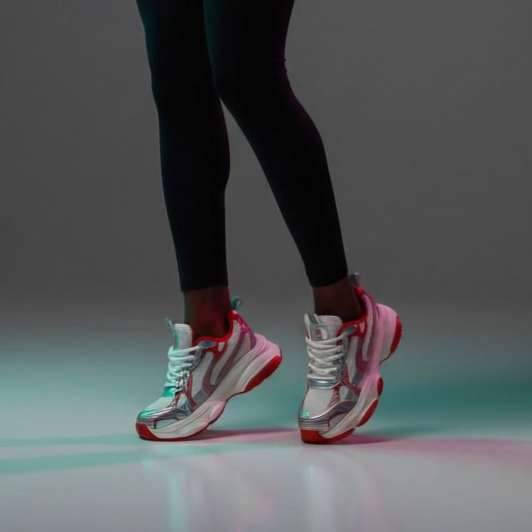 Enzo Motion X sneakers on legs: red inner collar, white upper, chunky sole