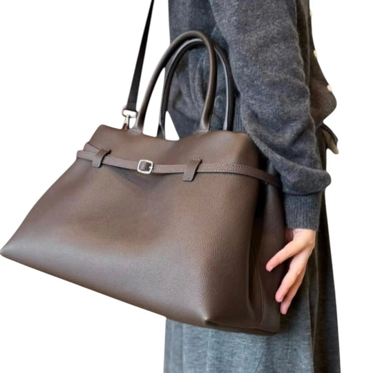 THE XL Sarah Large belt tote bag in taupe, front belt strap and metal buckle on textured leather.