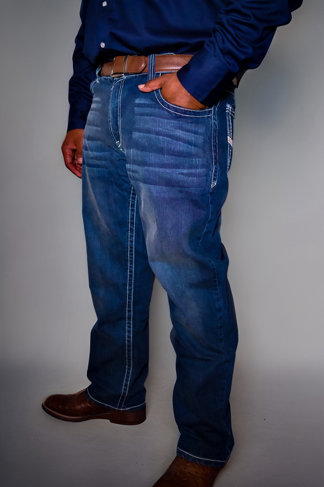 Alpha relaxed-fit bootcut jeans in dark blue wash, side view, belt loops and seams