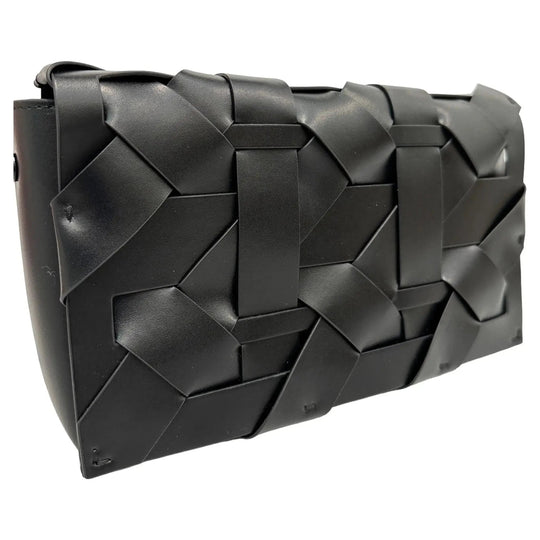 Black woven clutch with geometric cubes, angled view of front panels