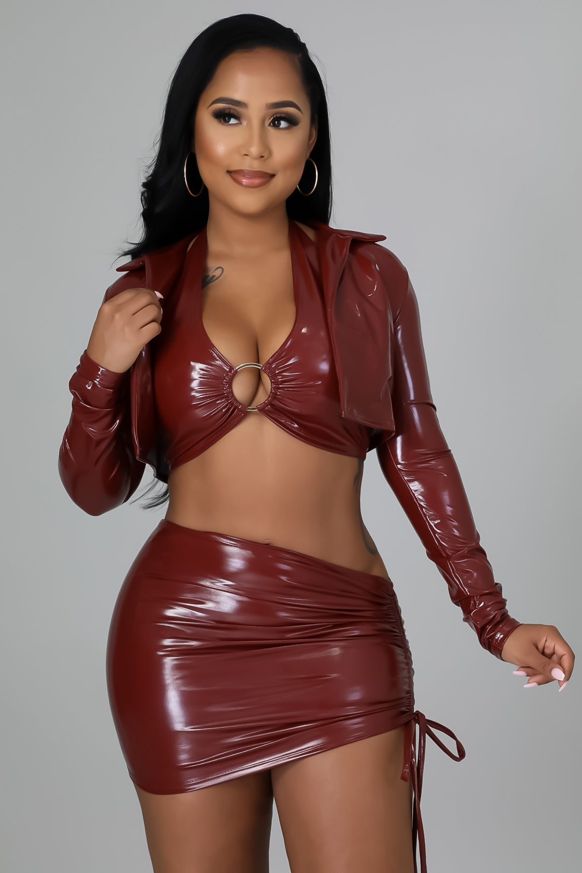 Burgundy faux-leather 3-piece set: ring halter crop top, ruched mini skirt, cropped jacket