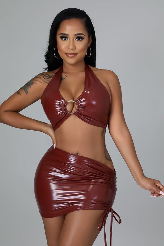 Burgundy faux-leather halter ring crop top and ruched mini skirt with side ties