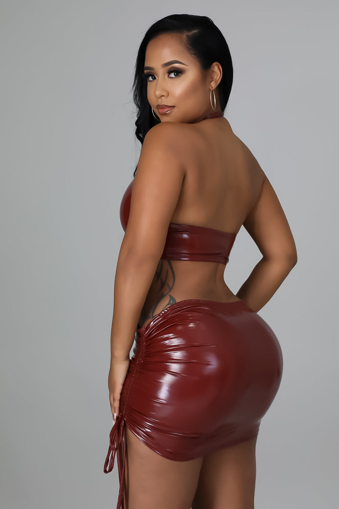 Burgundy faux-leather backless halter ring crop top, ruched mini skirt