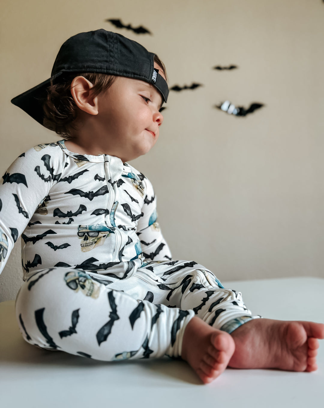 Zip-up bamboo pajama set with long sleeves and legs, bats and blue skull print
