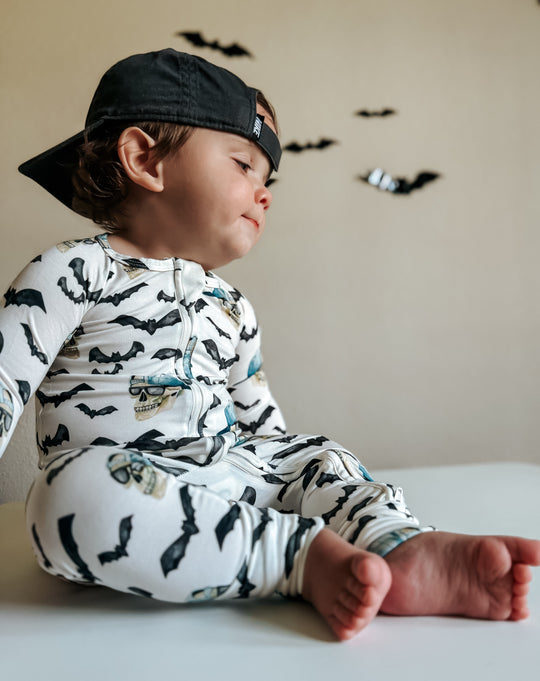 Zip-up bamboo pajama set with long sleeves and legs, bats and blue skull print