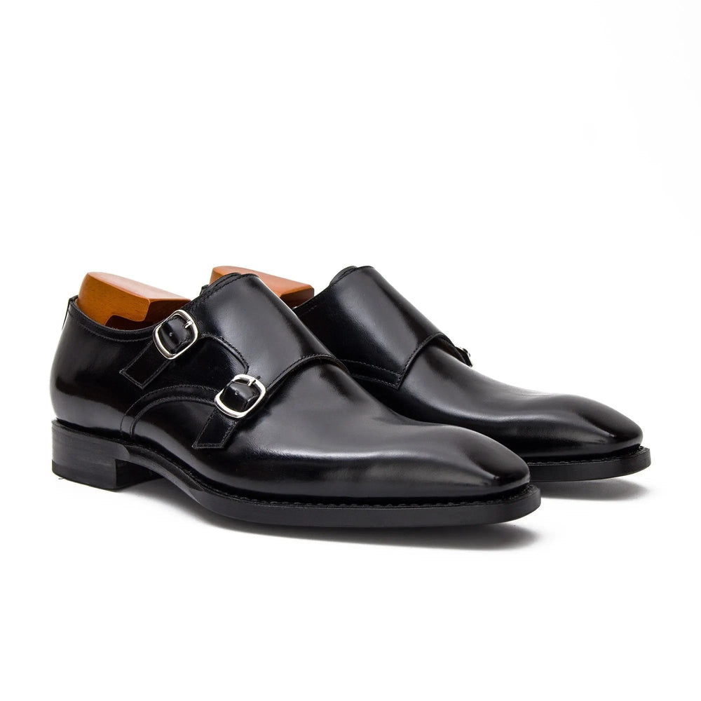 Black double monk shoes, angled front view with double buckle closure
