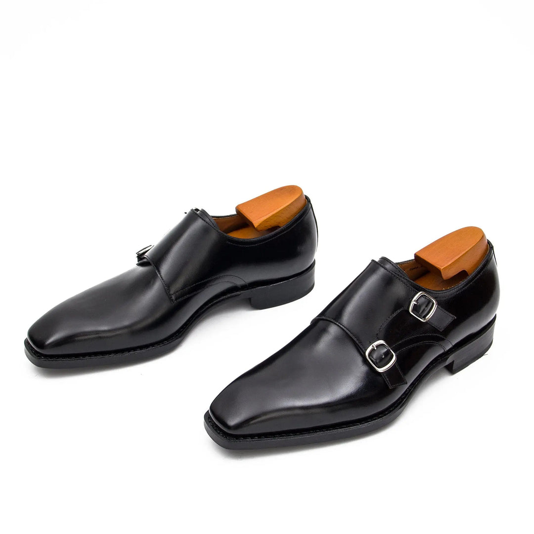Black double monk shoes, side view with two buckle straps and low heel