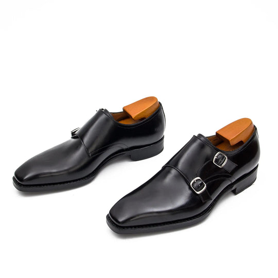 Black double monk shoes, side view with two buckle straps and low heel