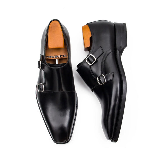 Black double monk shoes, angled top view showing two buckles and sleek toe