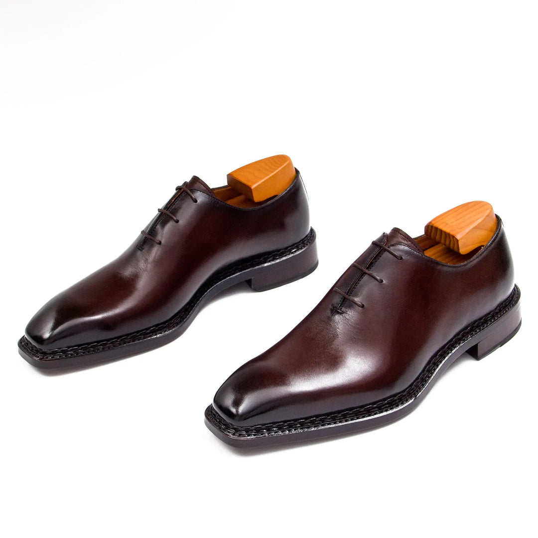 Dunkelbrauner Schnürschuh Oxford für Herren, 3/4-Seitenansicht mit Holzabsatz