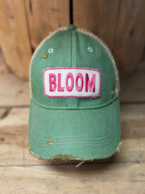 Green distressed mesh snapback cap with 'BLOOM' front patch