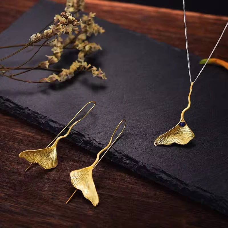 Ginkgo Elegance Pendant, gold ginkgo leaf with blue bead and wavy chain