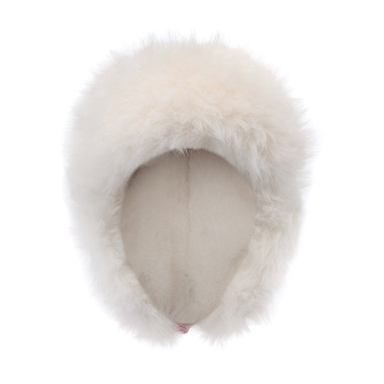 White faux-fur trapper hat from front, plush ear flaps framing the face opening