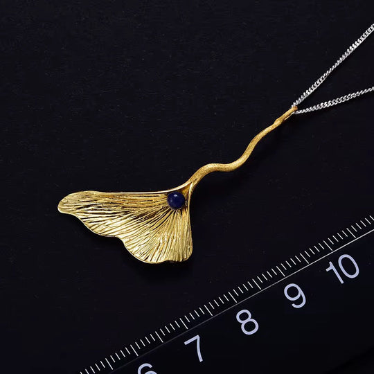 Ginkgo Elegance Pendant, gold leaf pendant with blue bead on chain
