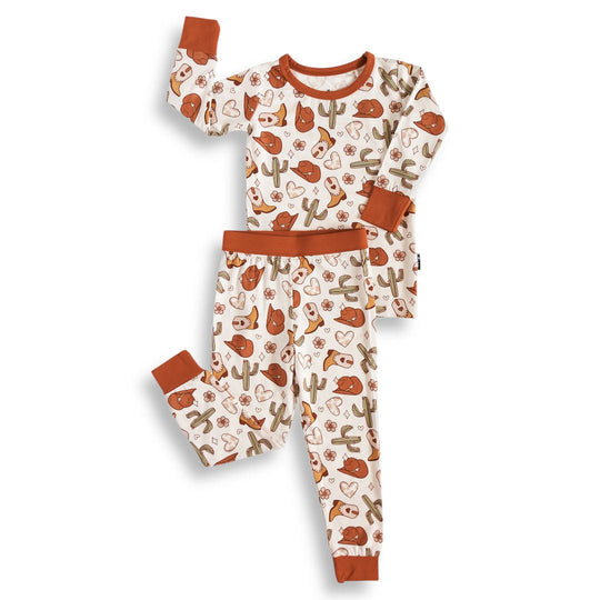 Kids two-piece pajama set: long-sleeve top and pants in white with orange trim