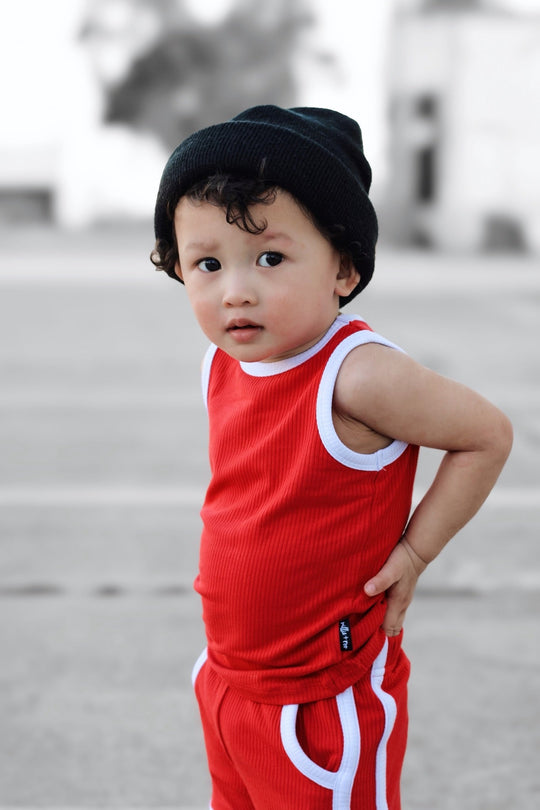 Red tank and shorts set with white collar trim and contrast stripe side edging