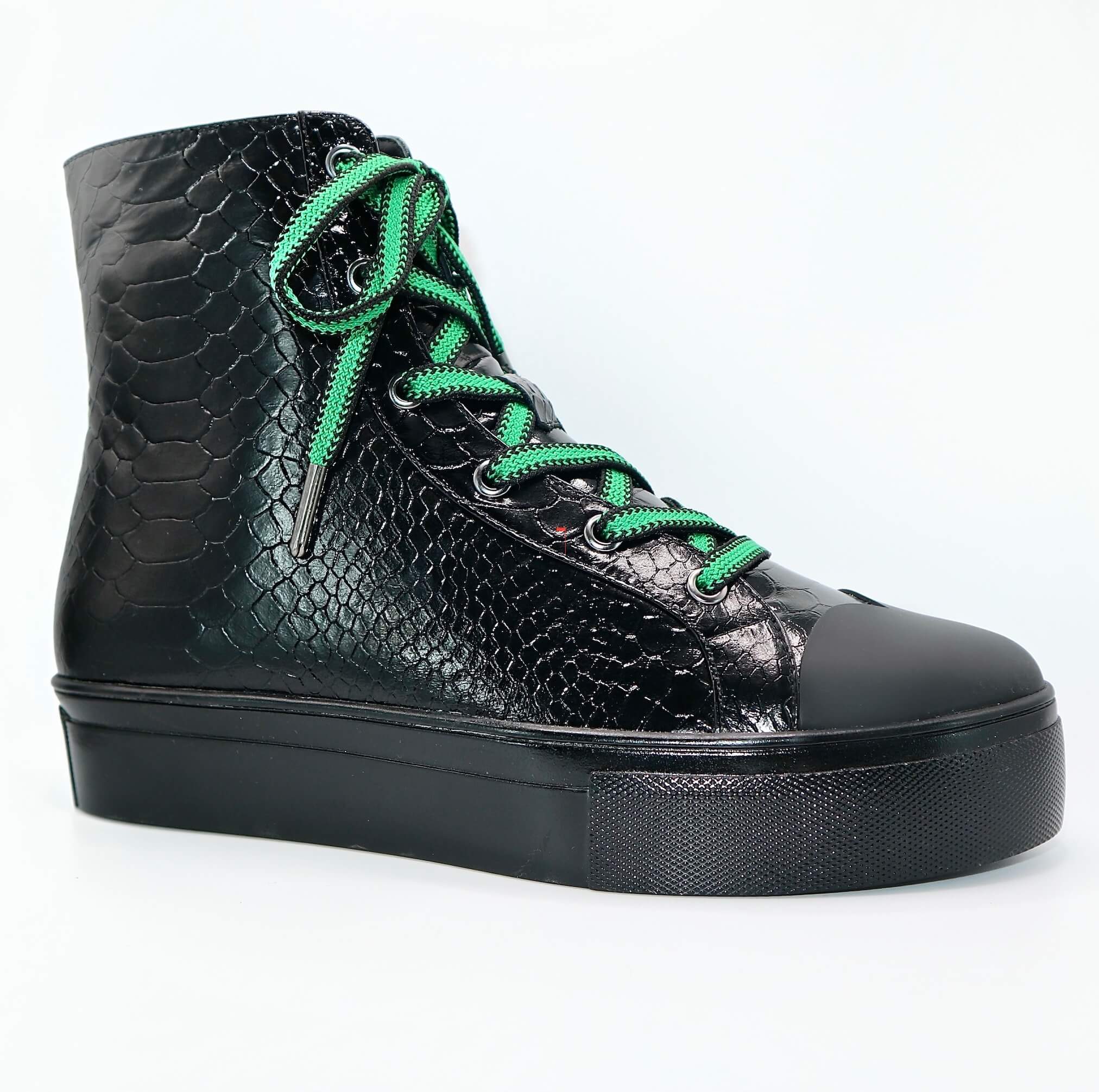 Black high-top sneakers with green laces, quilted texture and padded platform sole