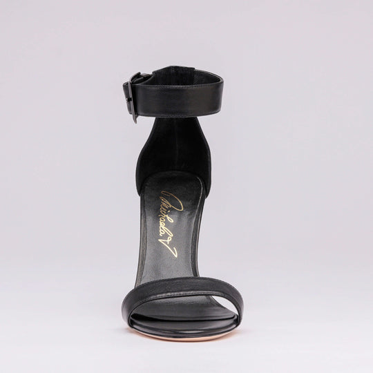 Black heeled sandal back view with ankle strap and open heel