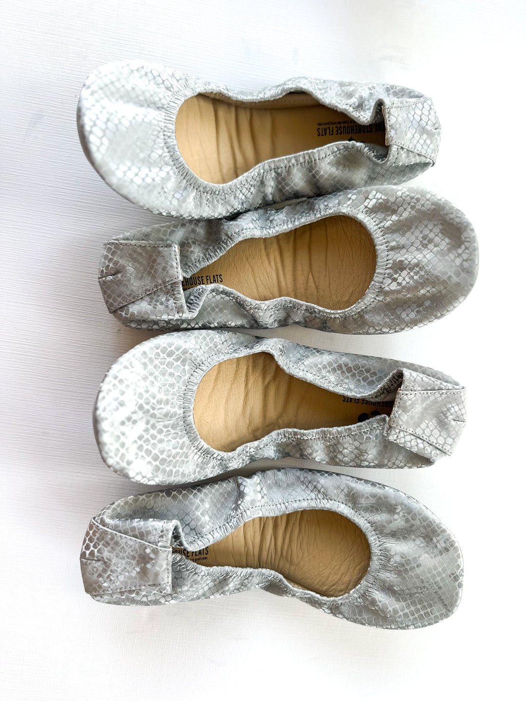 Dusty Snakes pointed-toe flats with snake-print uppers and elastic cuff