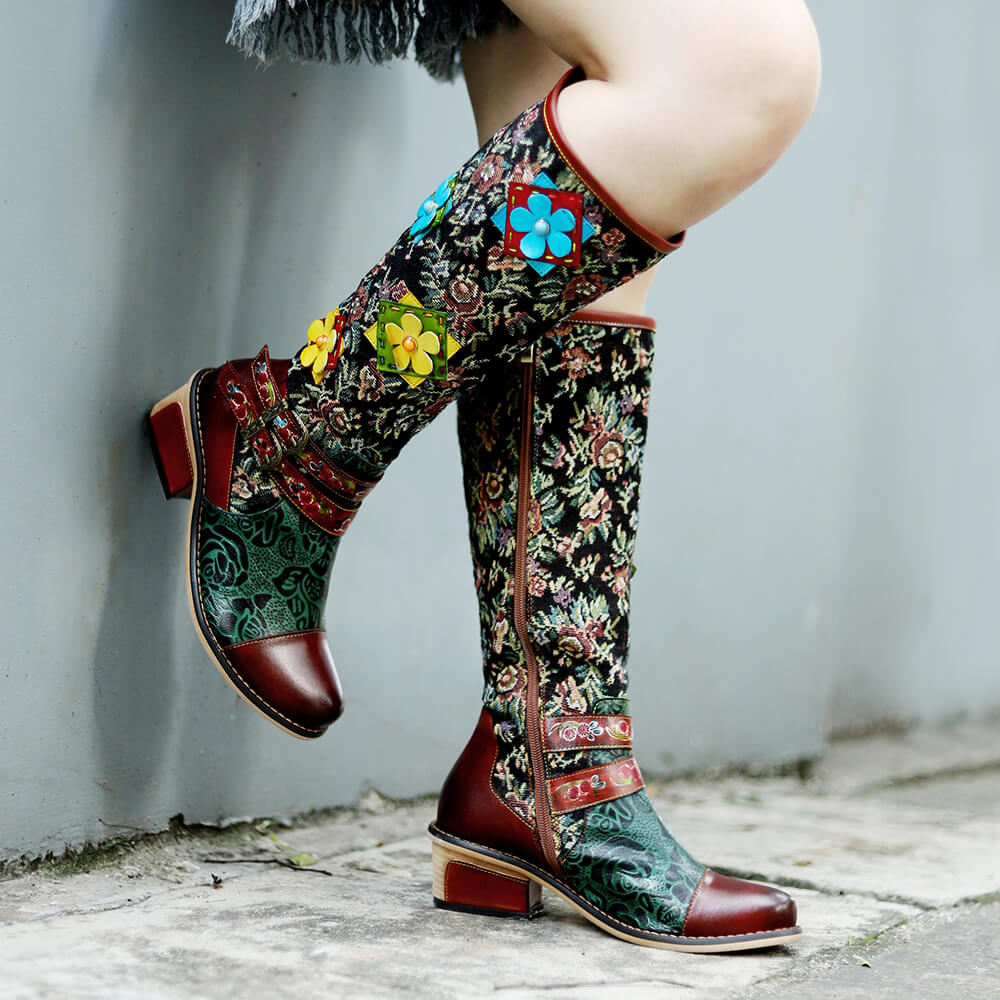 Side view of handmade floral boots with layered strap trim and flower appliqués