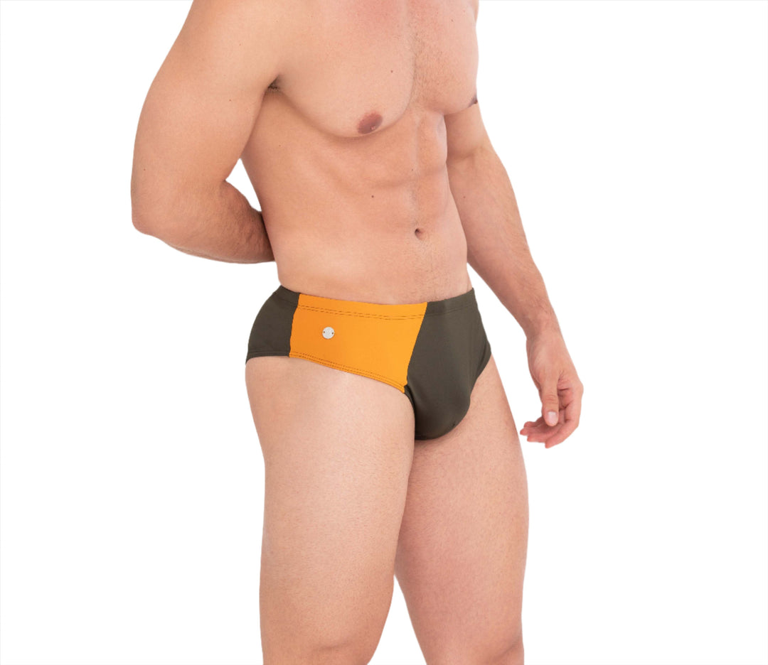 Front view swim brief in orange with dark side panels and button detail