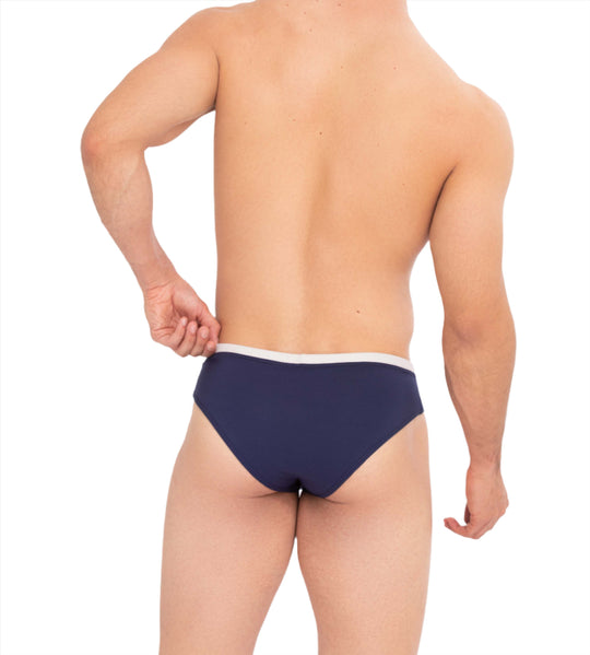 Back view: midnight blue swim brief with white waistband