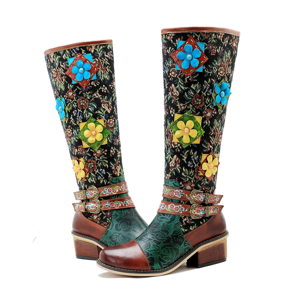 Front view tall boots featuring vintage floral fabric and bright flower appliqués