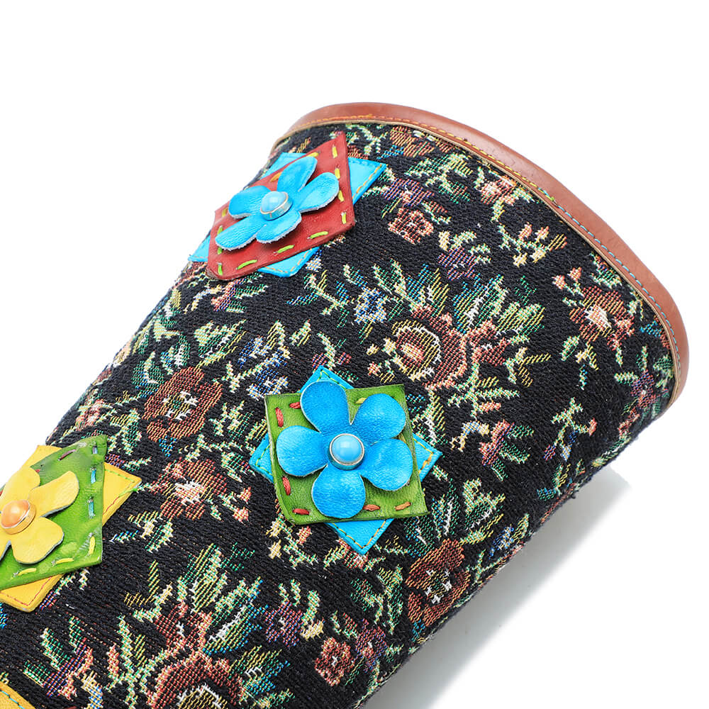 Multicolor floral ankle boots with blue flower appliqué on the upper