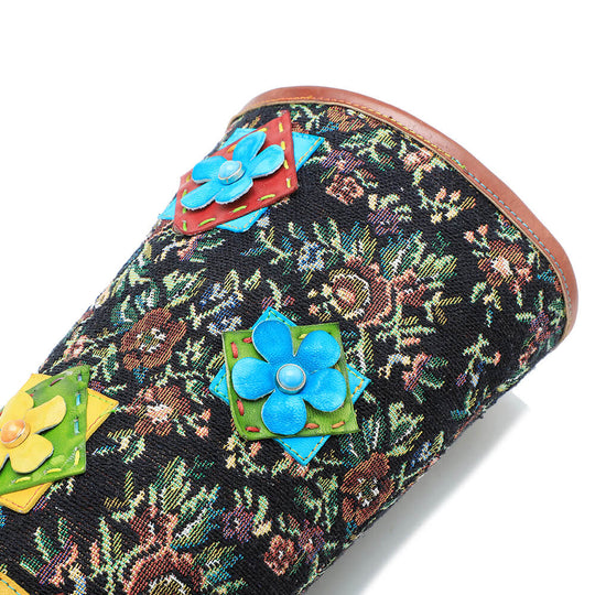 Multicolor floral ankle boots with blue flower appliqué on the upper