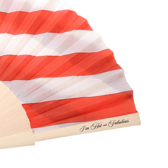 Hand fan close-up: red-and-white stripes with &