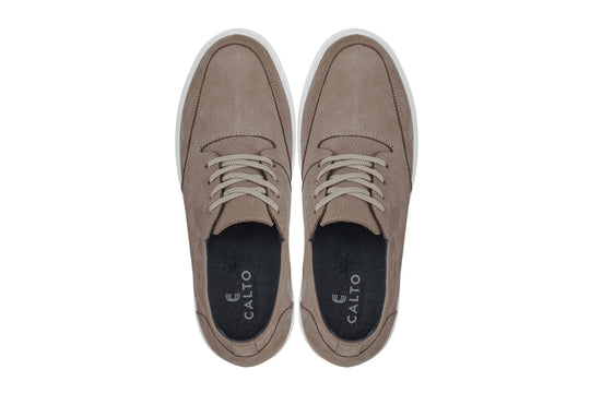 Khaki boots with lace-up top, dark insole lining, and white rubber sole