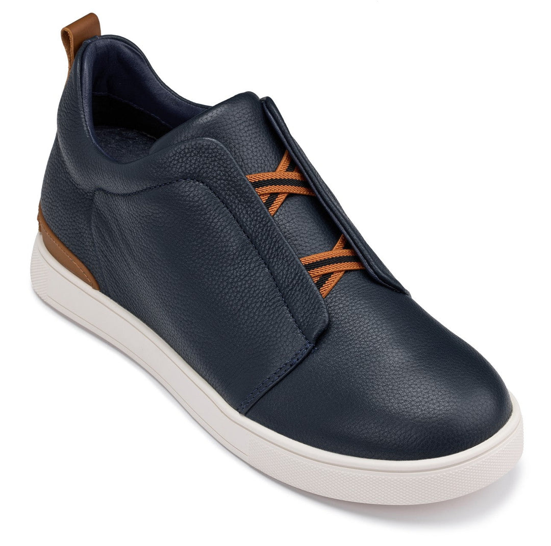Navy slip-on sneakers with tan trim and orange lace-look accents