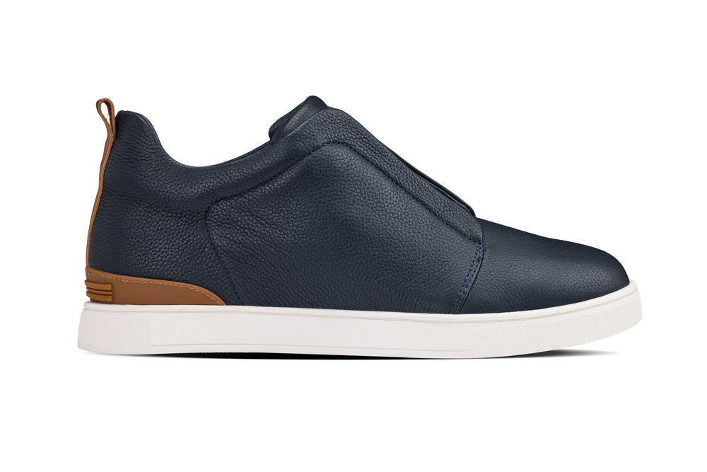 Navy slip-on sneaker with elastic gore panel and white rubber sole