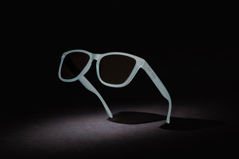 Blue Fringe Golf Sunglasses side view with dark lenses and curved temples