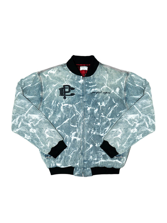 Reversible graffiti bomber: light blue splatter front with black ribbed cuffs and collar